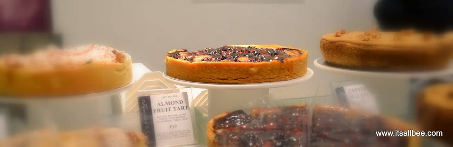 breakfast at borough market - A guide to Borough Market | Exploring London Through Food #london #food #foodguide #markets #citybreak #exploring #breakfast Cake Stalls at Borough Market