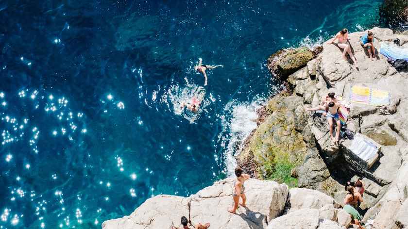 Summer swim outside the city walls of Dubrovnik